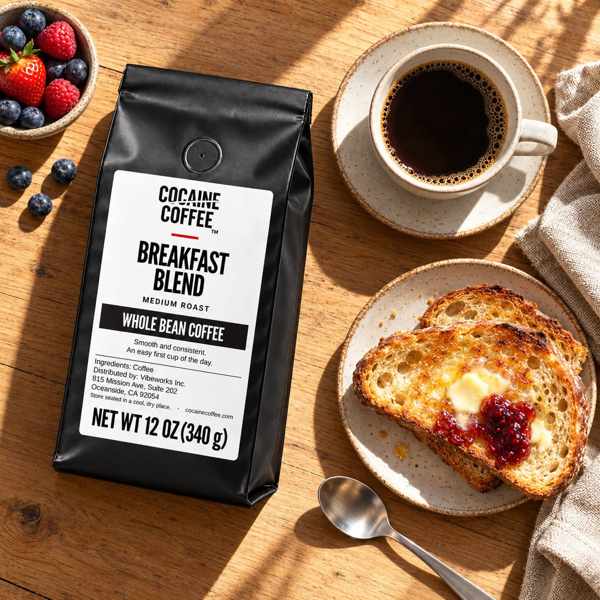 Breakfast Blend bag with toast, berries and a cup of coffee, top view