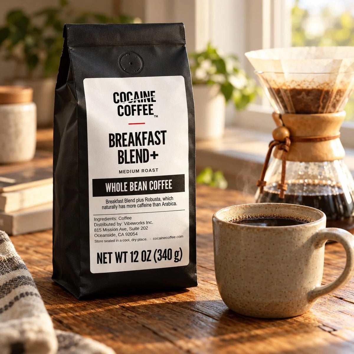 Breakfast Blend+ bag beside a pour-over and a mug of coffee