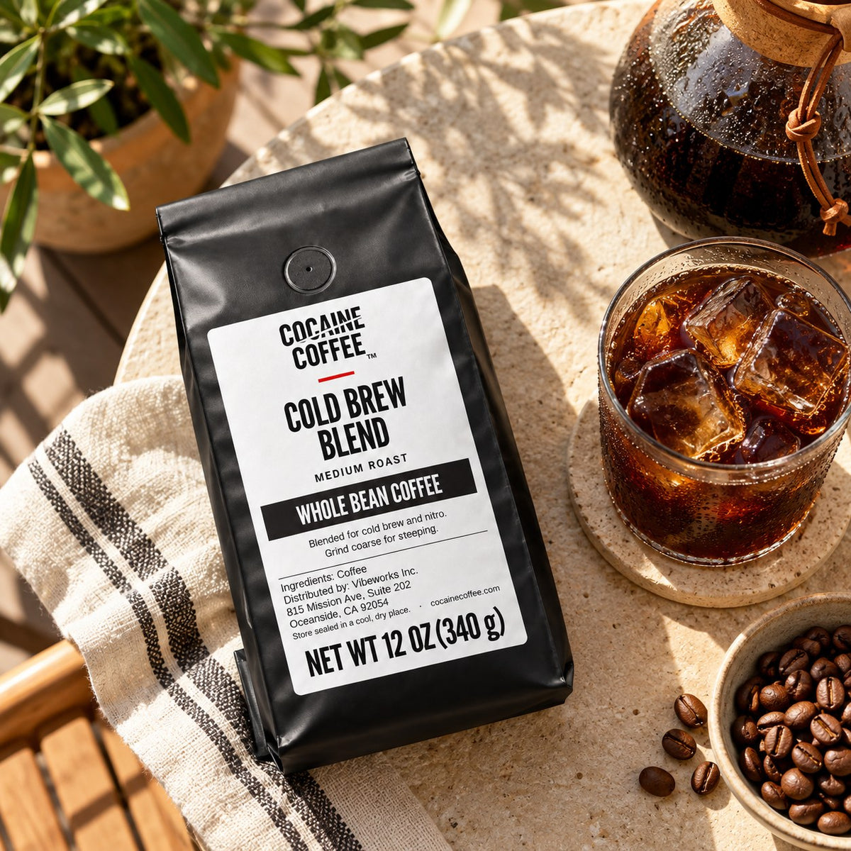 Cold Brew Blend coffee bag with beans and a cup, top view