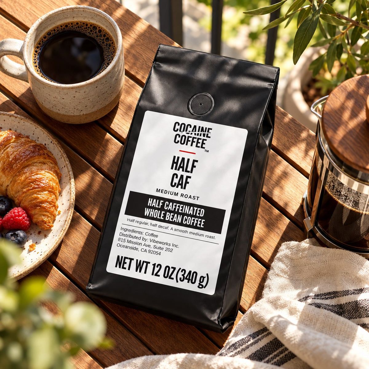 Half Caf coffee bag with beans and a cup, top view