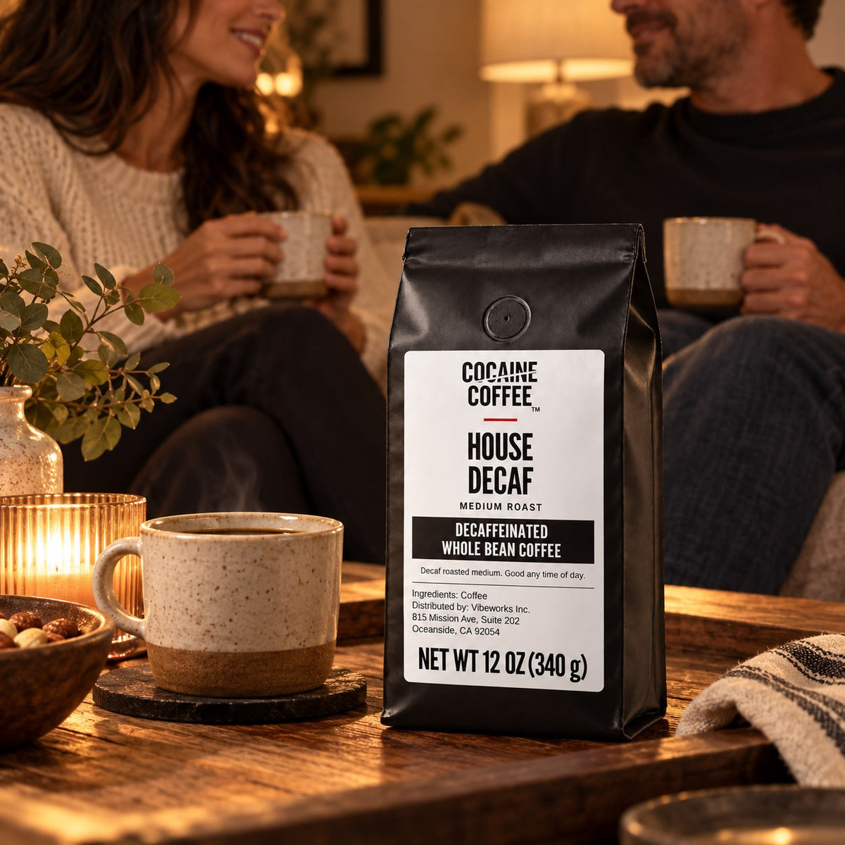 House Decaf coffee bag on the table with a cup of coffee