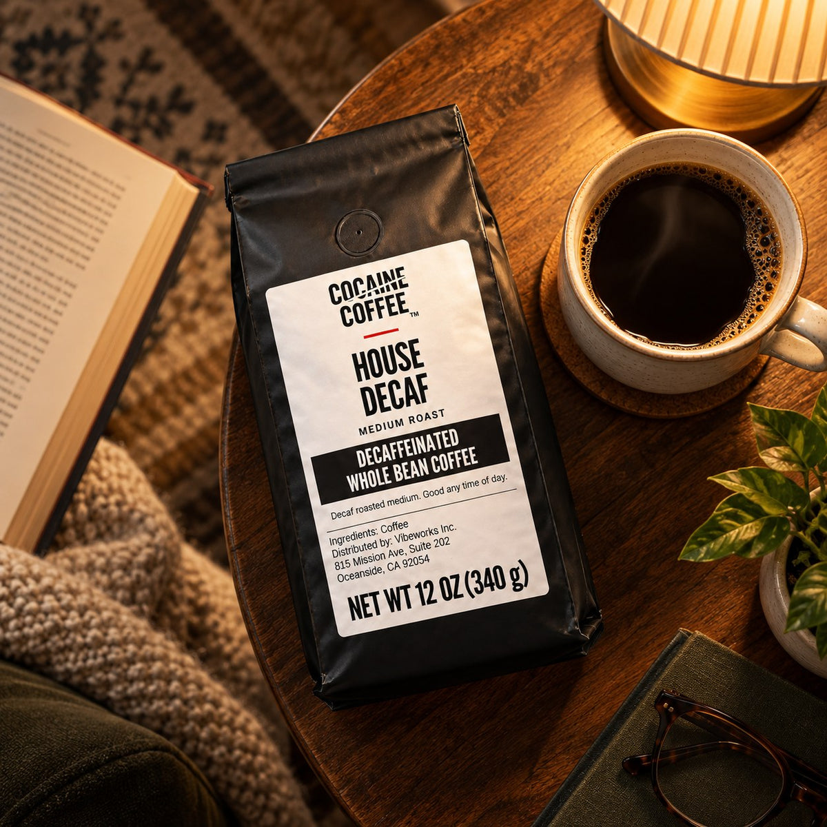 House Decaf coffee bag with beans and a cup, top view