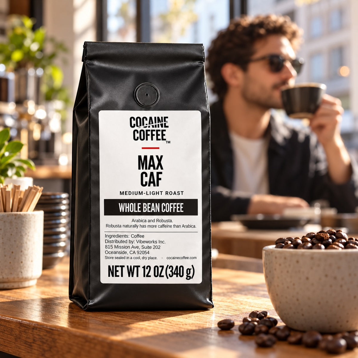 Max Caf coffee bag on the table with a cup of coffee