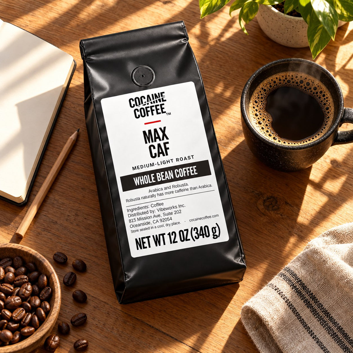 Max Caf coffee bag with beans and a cup, top view