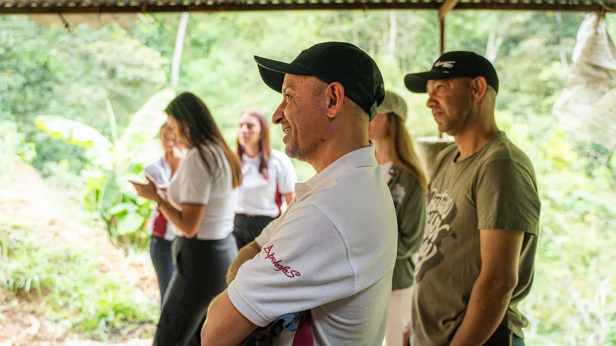 Elkin with visitors at Aprokafes in Caicedo, Colombia