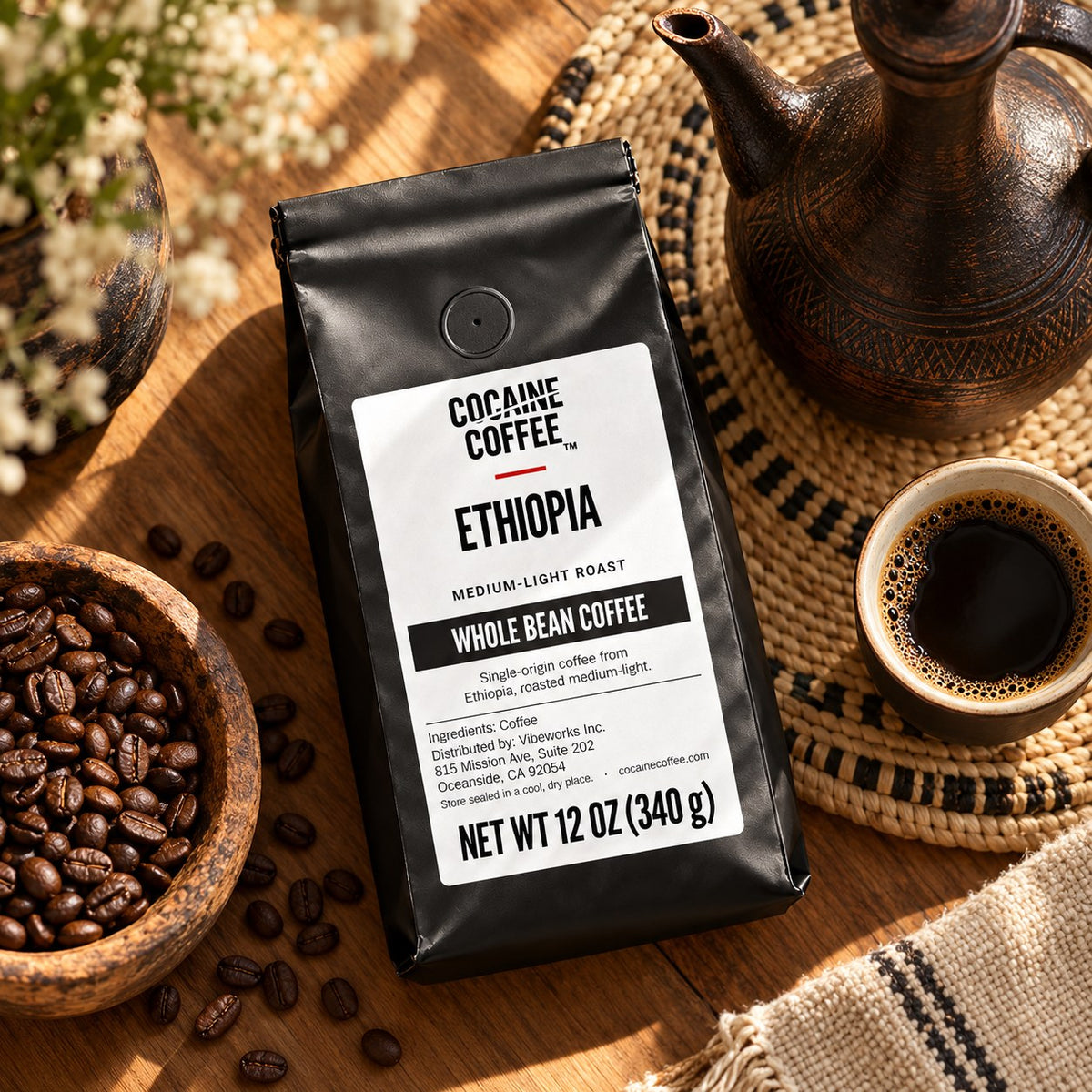 Ethiopia coffee bag with beans and a cup, top view