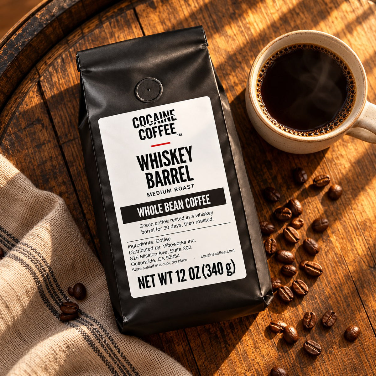Whiskey Barrel coffee bag with beans and a cup, top view