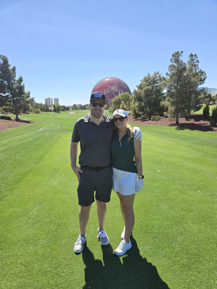 Ryan and Yulia on a golf course